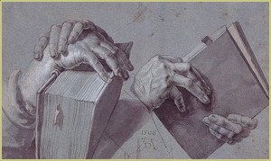 Two Hands Holding A Pair Of Books